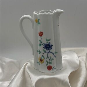 This is a Haviland Limoges France Shalimar porcelain pitcher with floral design